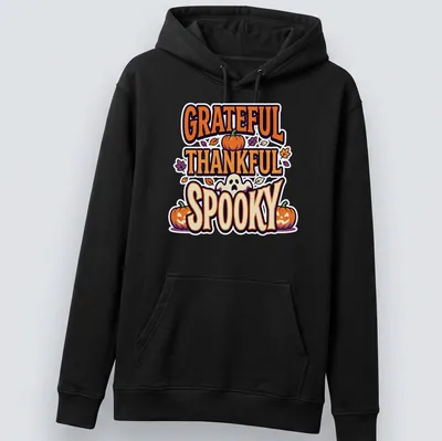 Playful cartoon graphic of pumpkins with 'GRATEFUL THANKFUL SPOOKY' text — printed on a unisex hoodie