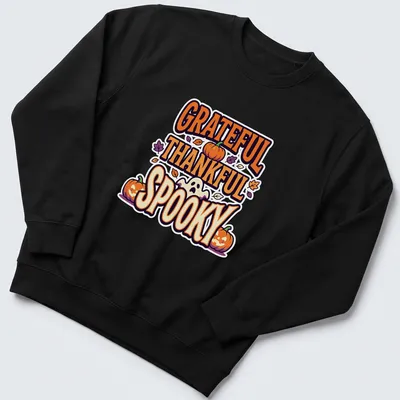 Playful cartoon graphic of pumpkins with 'GRATEFUL THANKFUL SPOOKY' text — printed on a unisex sweatshirt