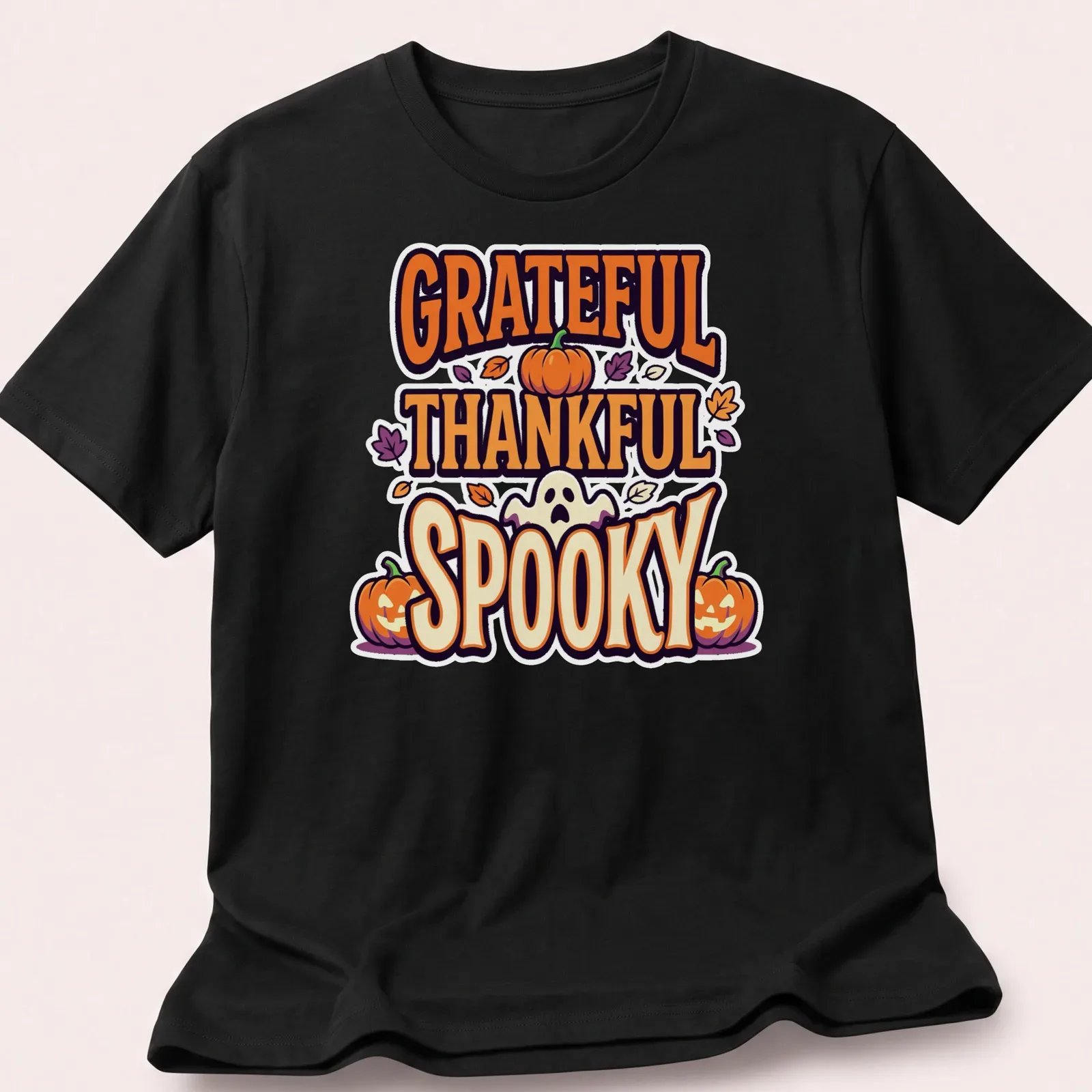 Playful cartoon graphic of pumpkins with 'GRATEFUL THANKFUL SPOOKY' text — printed on a unisex t-shirt
