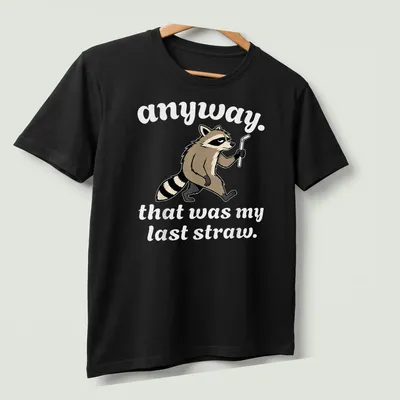 Cartoon raccoon with the phrase 'anyway. that was my last straw.' printed in brown, black, and white. — printed on a unisex t-shirt (angled view)