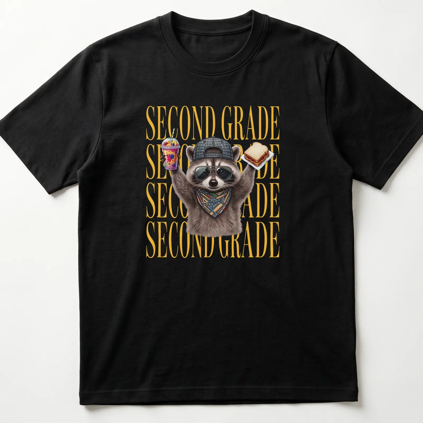 Funny cartoon raccoon above the text 'SECOND GRADE' in bright colors — printed on a unisex t-shirt