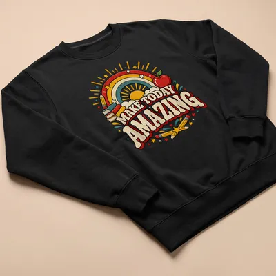 Colorful retro T-shirt featuring rainbow, apple, books, stars, and pencils with inspirational text. — printed on a unisex sweatshirt