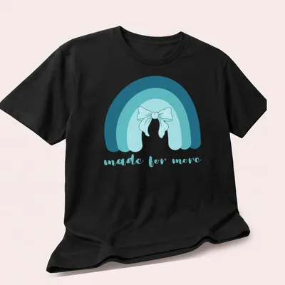 Cute rainbow with bow and the phrase made for more in soft colors — printed on a unisex t-shirt (angled view)