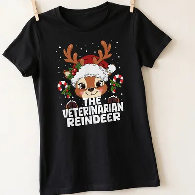 Kawaii cartoon reindeer with text 'The Veterinarian Reindeer' in festive colors — printed on a women's shirt