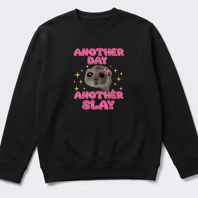 Kawaii design of a sad hamster with the text Another Day Another Slay in bright colors — printed on a unisex sweatshirt
