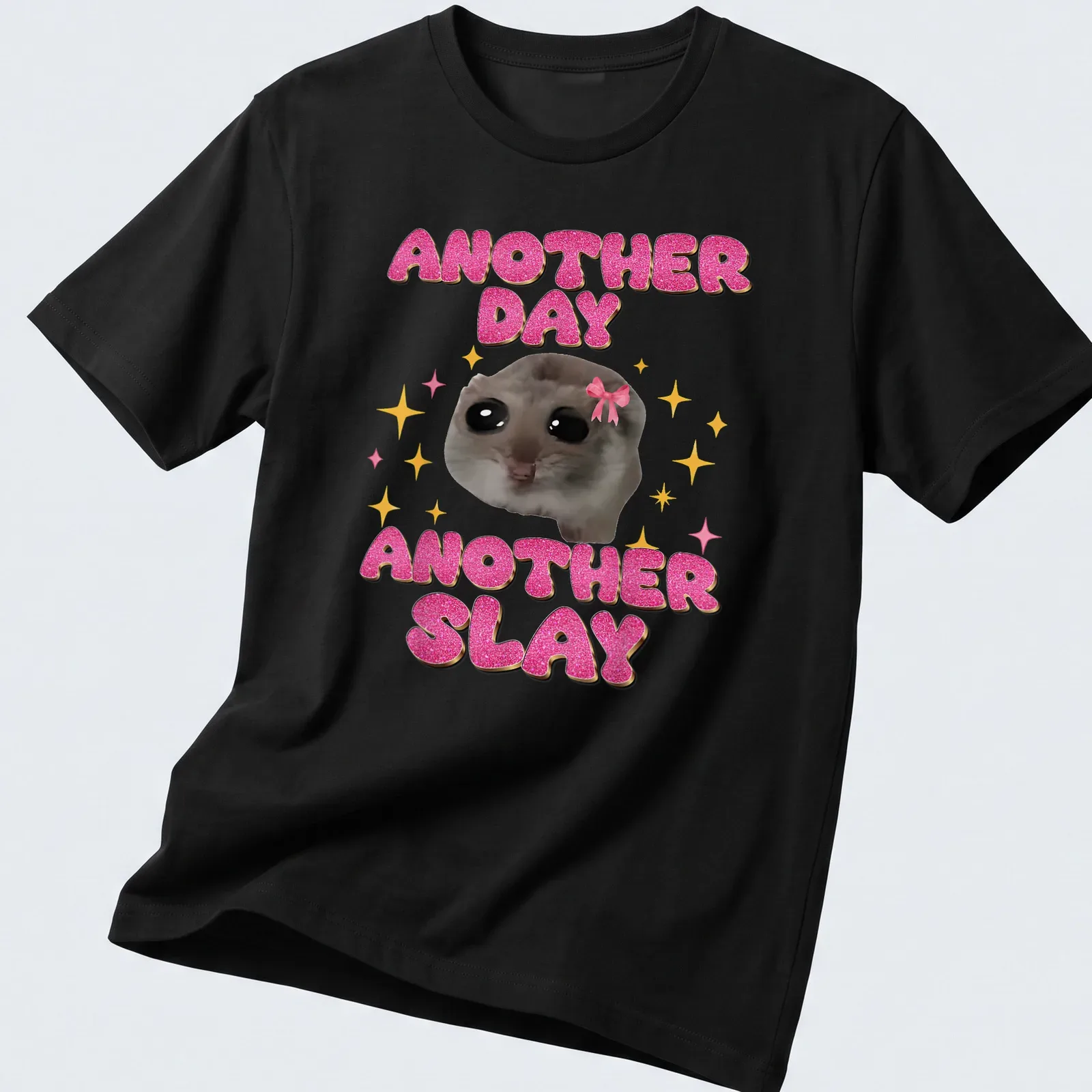 Kawaii design of a sad hamster with the text Another Day Another Slay in bright colors — printed on a unisex t-shirt