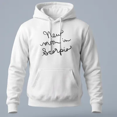 Black shirt with handwritten text 'New moon in Scorpio' in elegant script. — printed on a unisex hoodie