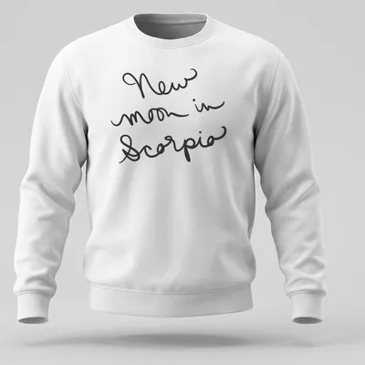 Black shirt with handwritten text 'New moon in Scorpio' in elegant script. — printed on a unisex sweatshirt