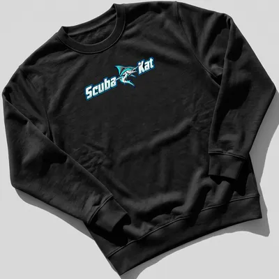 Bold graphic of a scuba diving cat next to a marlin fish in turquoise and black — printed on a unisex sweatshirt