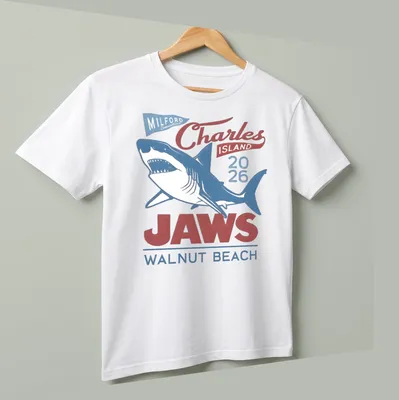 Vintage T-shirt featuring a shark graphic with red, blue, and white text. — printed on a unisex t-shirt (angled view)