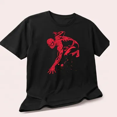 Spider-Man silhouette with splatter effects in dynamic colors of red, black, gold, and white — printed on a unisex t-shirt (angled view)