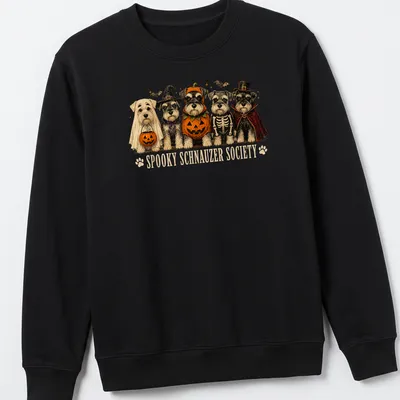 Whimsical illustration of Schnauzer dogs in Halloween skeleton costumes with colorful text above — printed on a unisex sweatshirt