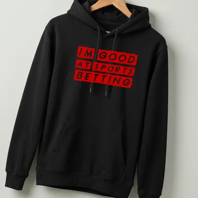 Bold graphic t-shirt featuring the phrase 'I'm Good At Sports Betting' in red and white — printed on a unisex hoodie