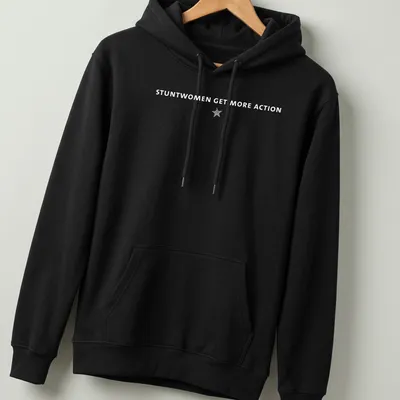 Bold typography t-shirt featuring the text 'Stuntwomen Get More Action' in white and gray — printed on a unisex hoodie