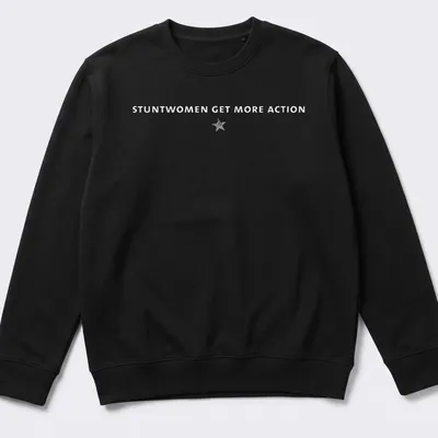 Bold typography t-shirt featuring the text 'Stuntwomen Get More Action' in white and gray — printed on a unisex sweatshirt