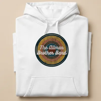 Vintage Allman Brother Band t-shirt featuring colorful text in a retro style — printed on a unisex hoodie