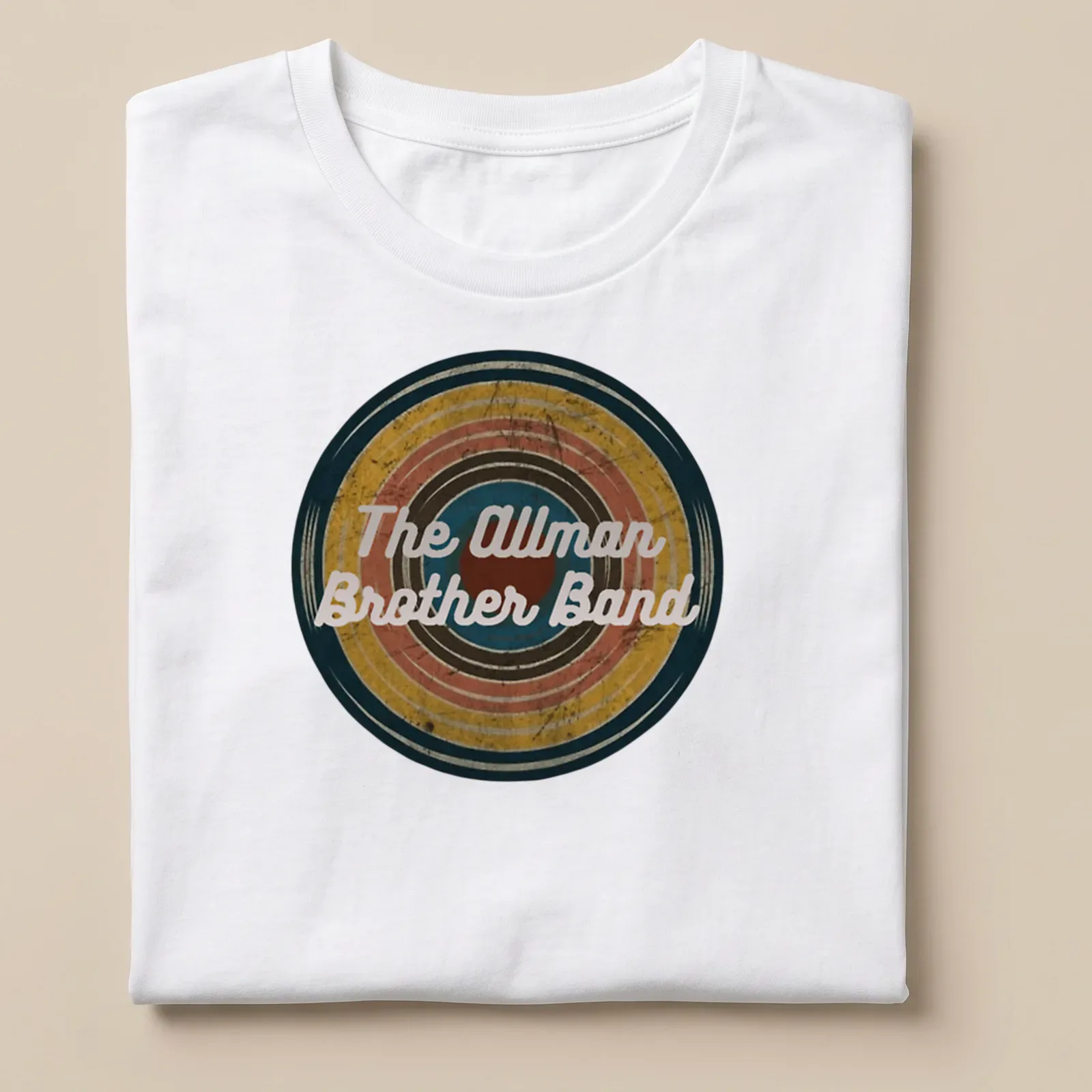Vintage Allman Brother Band t-shirt featuring colorful text in a retro style — printed on a unisex t-shirt