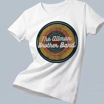 Vintage Allman Brother Band t-shirt featuring colorful text in a retro style — printed on a women's shirt