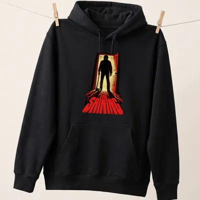 Vintage horror tee featuring iconic axe-wielding figure from The Shining — printed on a unisex hoodie