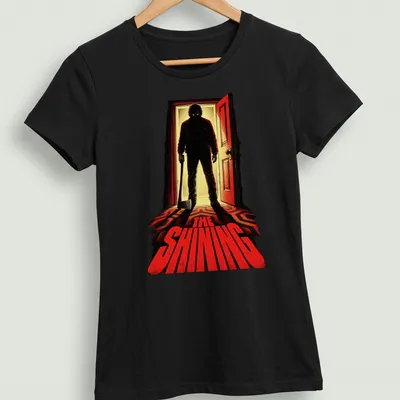 Vintage horror tee featuring iconic axe-wielding figure from The Shining — printed on a women's shirt