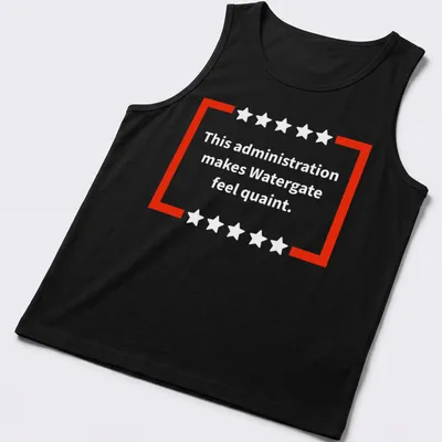 Red and white t-shirt featuring bold text of a political commentary — printed on a tank top
