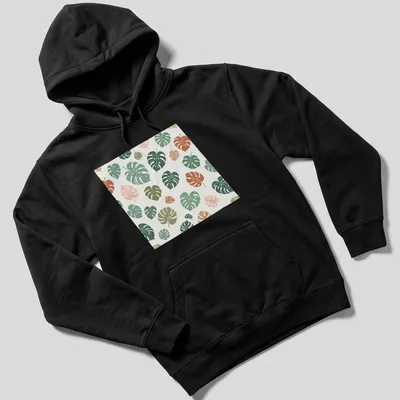 Botanical pattern T-shirt featuring tropical Monstera leaves in various colors — printed on a unisex hoodie