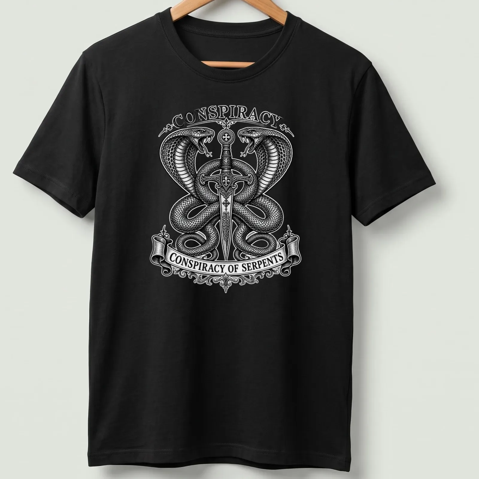 Occult engraving of twin cobras and sword with text 'Conspiracy of Serpents' — printed on a unisex t-shirt