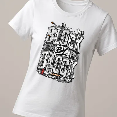 Bold graffiti style Urban Cityscape T-shirt with buildings and text — printed on a women's shirt