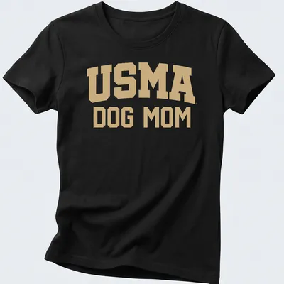 Bold collegiate design USMA Dog Mom t-shirt in gold and white text — printed on a women's shirt