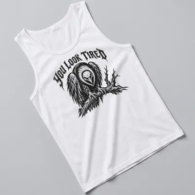 Vintage distressed t-shirt featuring a cartoon vulture and the phrase 'YOU LOOK TIRED' — printed on a tank top