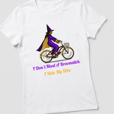 Vintage illustration of a witch riding a bike with playful text about broomsticks. — printed on a women's shirt