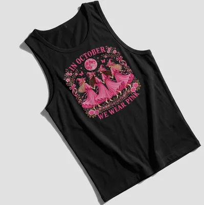 Whimsical illustration of witch sisters with text 'In October We Wear Pink' in pink tones. — printed on a tank top
