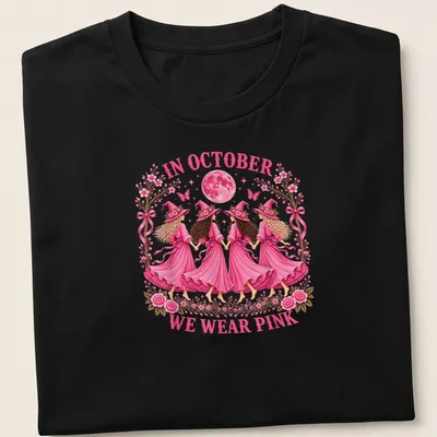 Whimsical illustration of witch sisters with text 'In October We Wear Pink' in pink tones.