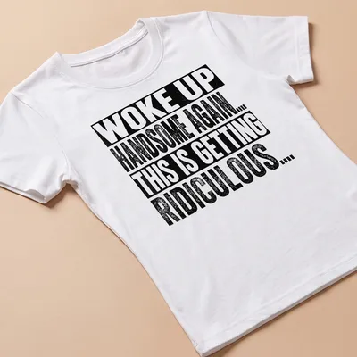 Bold vintage shirt with humorous affirmation about being handsome. — printed on a women's shirt